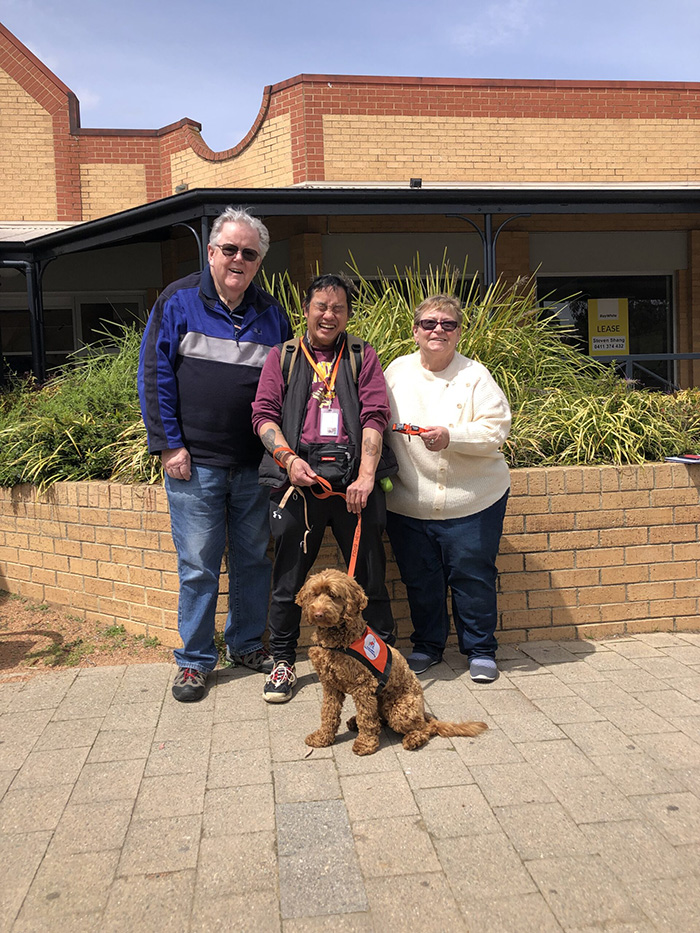 Recipient Dom and Hearing Dog Katie, with Lions Club of Canberra Belconnen